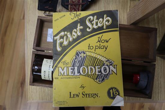 A Hohner Melodian Accordian and booklet